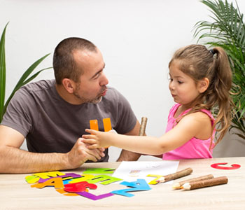 A dad helping daughter with Articulation Difficulties-SL Hunter Speechworks