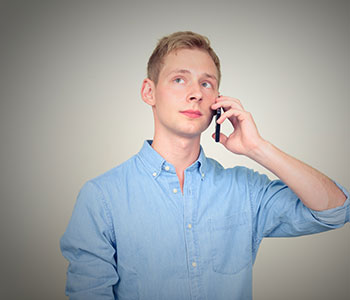Young man stuttering on phone call, treated by S.L. Hunter Speechworks in Burlington Ontario